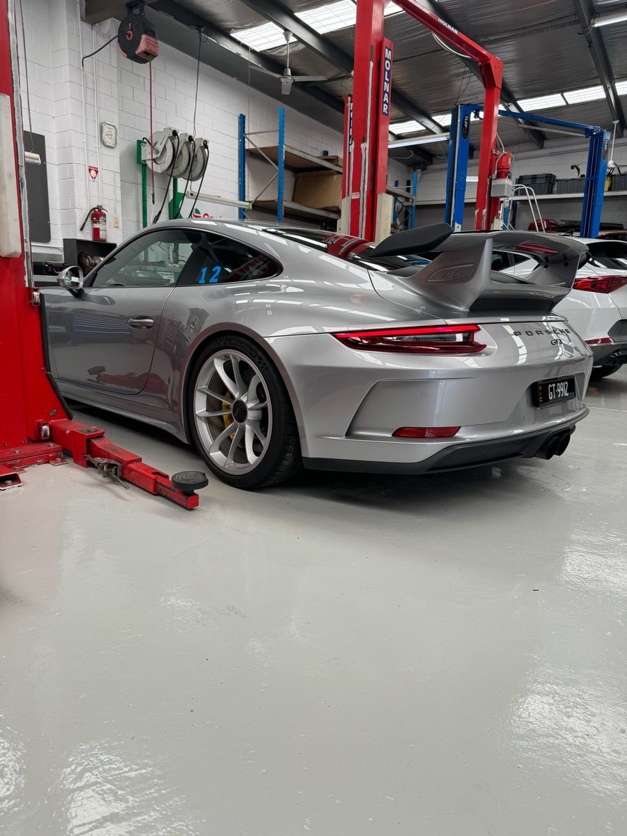 A car up on the hoist in the Ringwood workshop